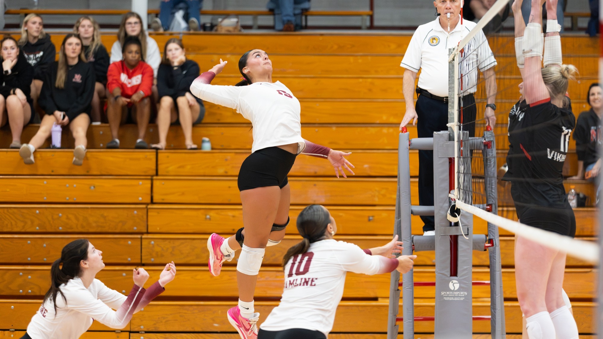 Lydia Graham goes up for a hit against BLC