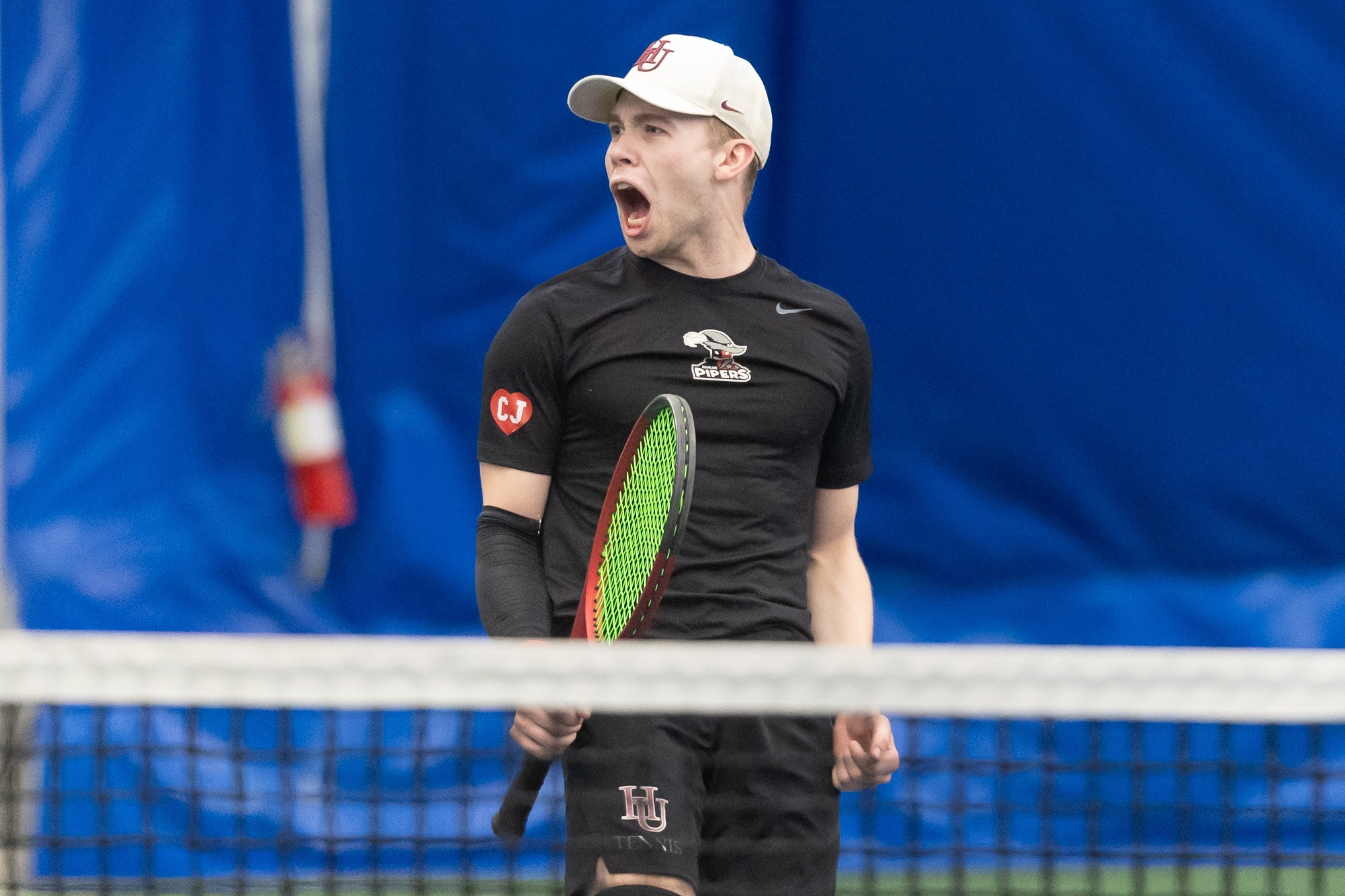 Liam Smith celebrates against St. Scholastica (3/22/2026)