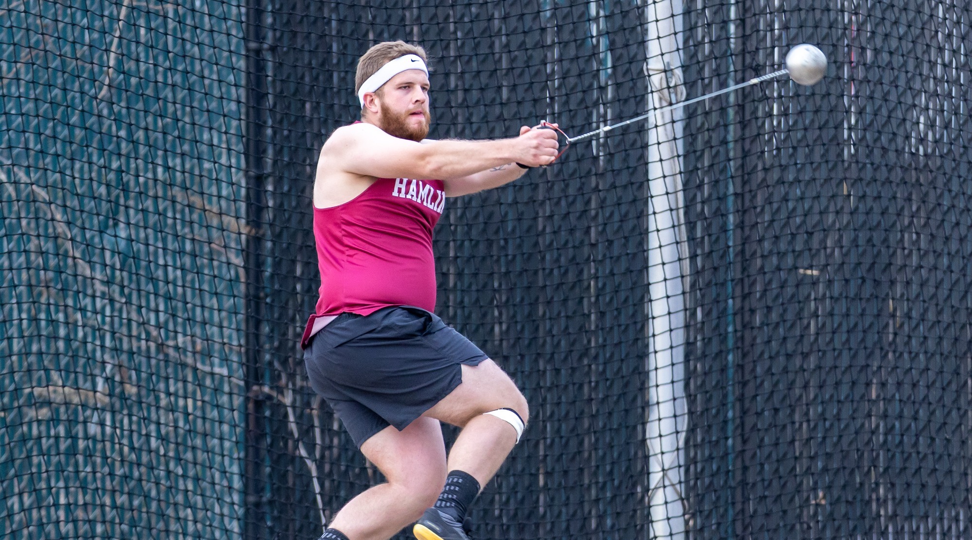 Doug Gill winds up for the hammer throw at Hamline Invitational 