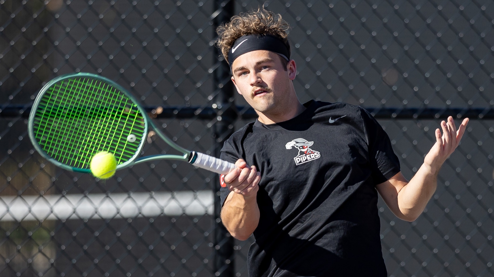 Wesley Saunders hitting the ball, Hamline Men's Tennis vs Bethel 2026