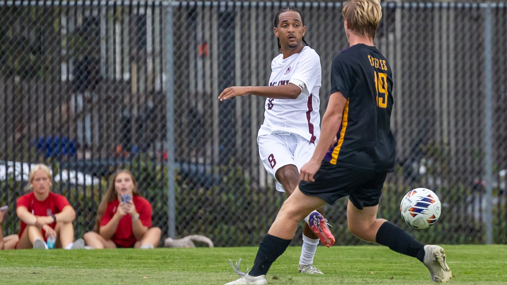 Makonnen kicking the ball against Northwestern