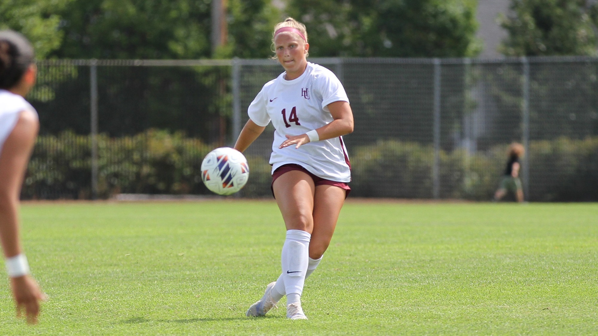 Josie Carlson kicking the ball against BLC