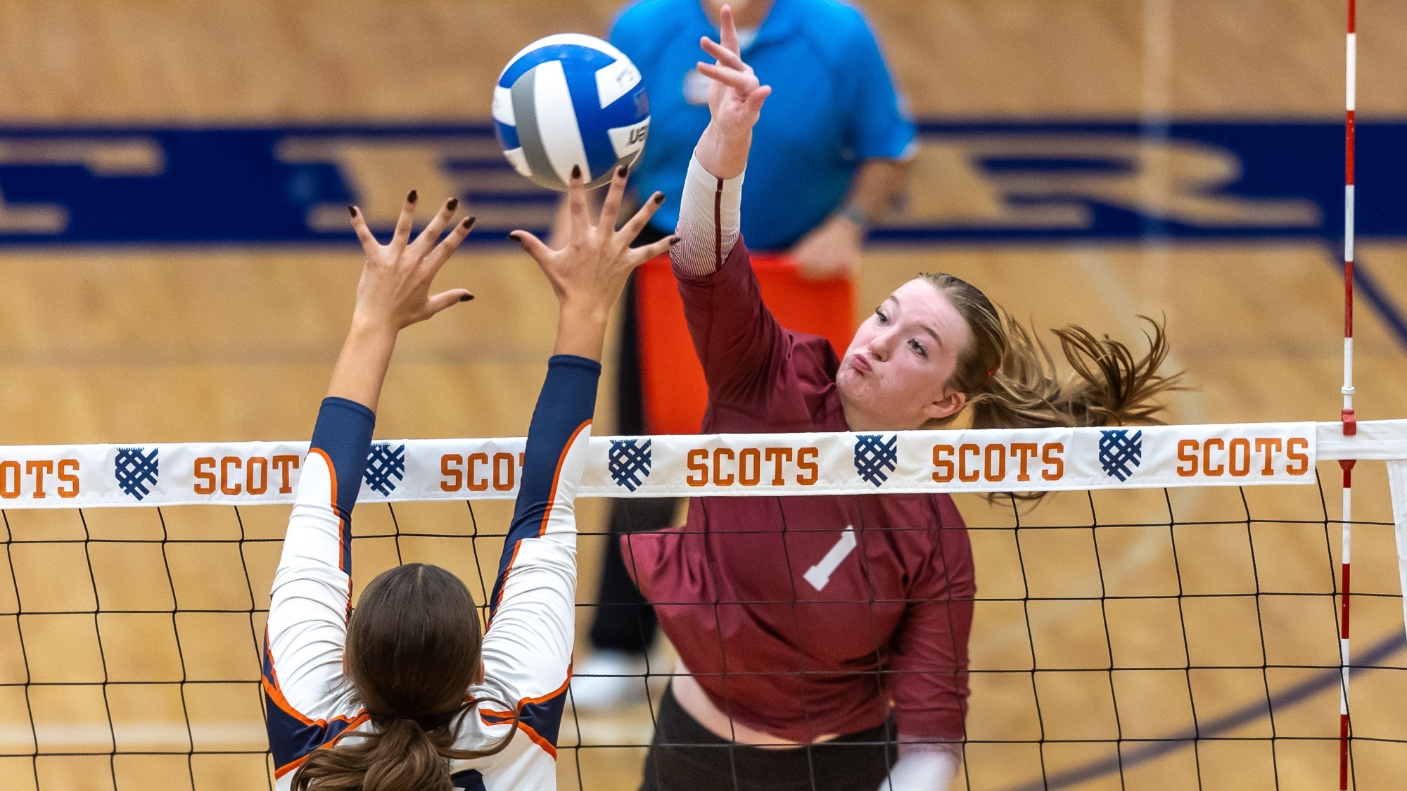Sophia Johnson going up for a kill against Macalester