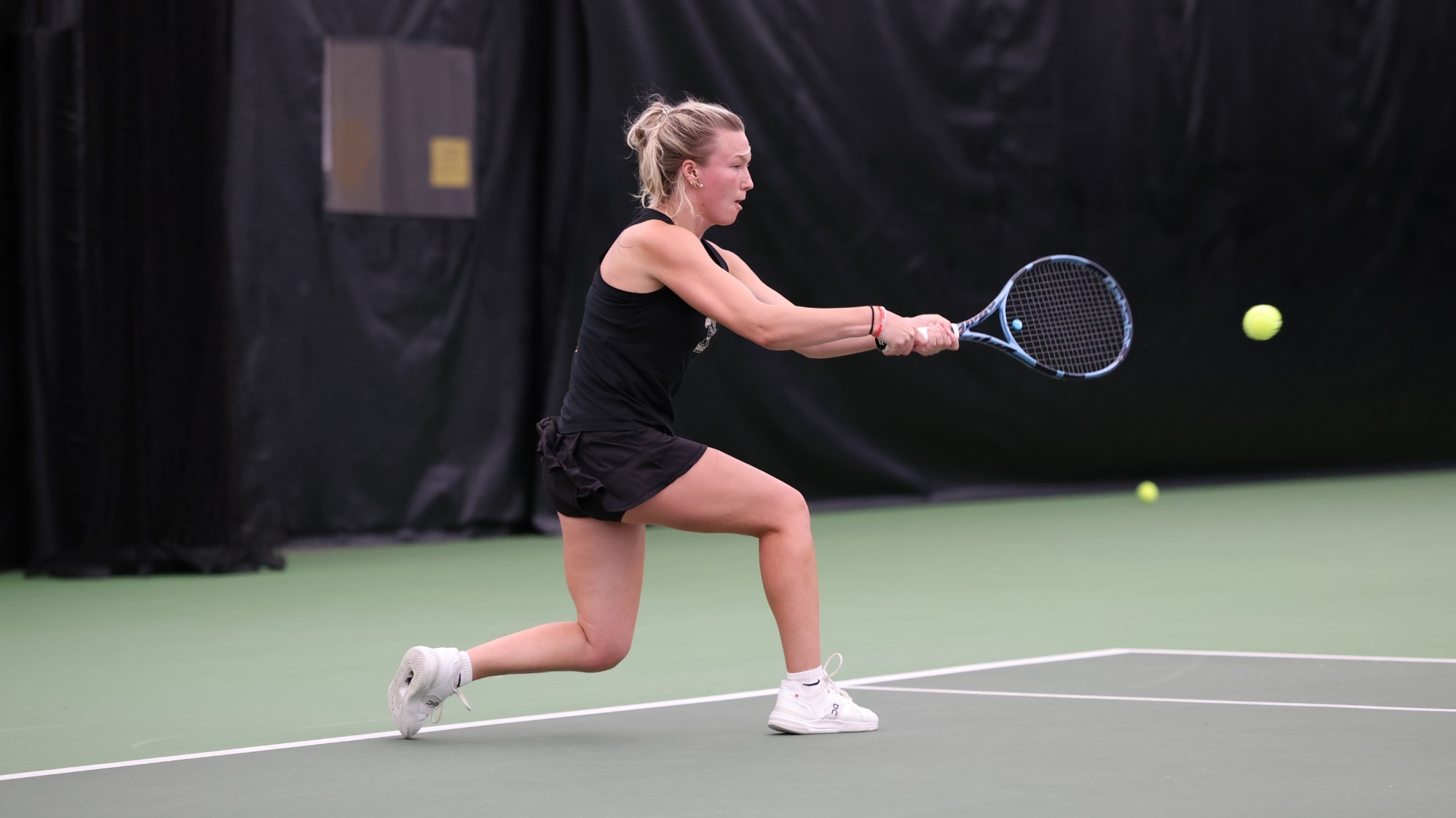 Elanna Kohner swinging at the ball during ITA match
