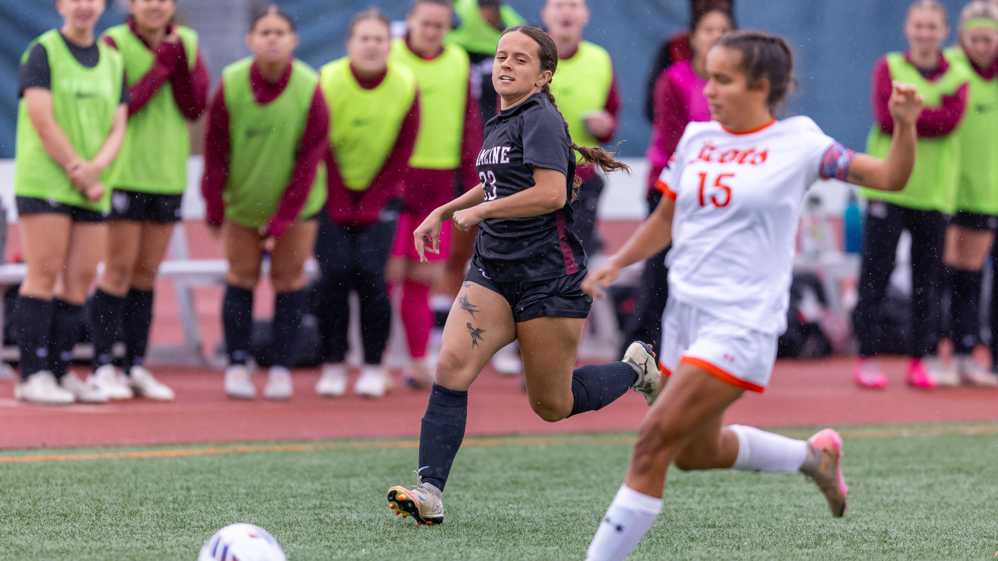 Alexis Geary running after the ball against Macalester 