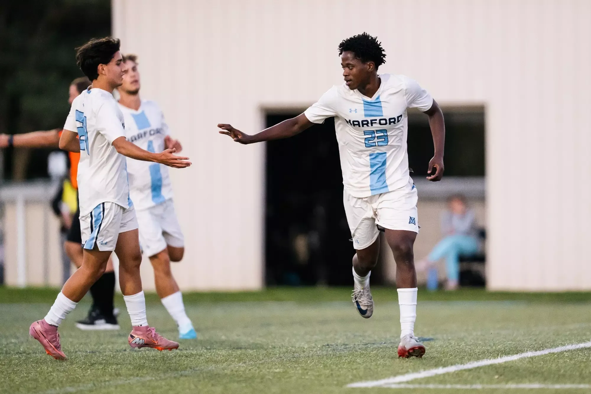 Harford men's soccer players celebrate a goal