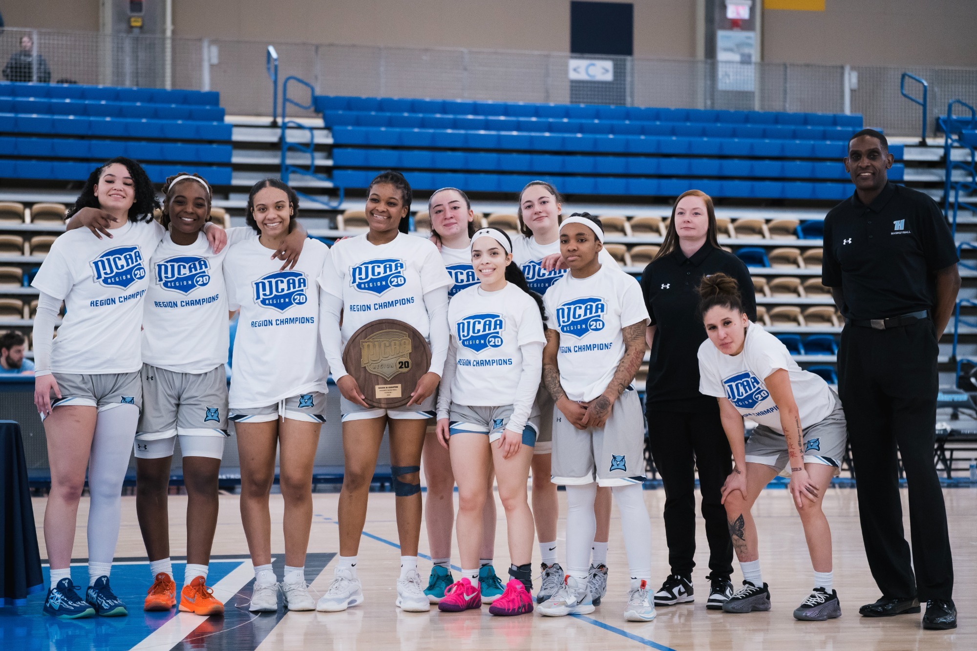 Harford Women's Basketball team poses for a photo to celebrate winning the region for the second straight season. 