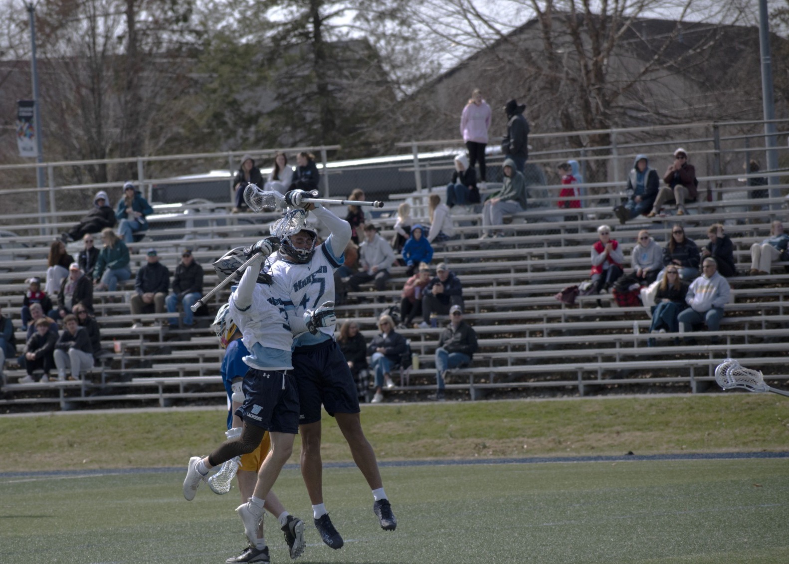 Two Harford players celebrate a goal in their 28-5 defeat of Genesee | Photo by Josh Brethauer