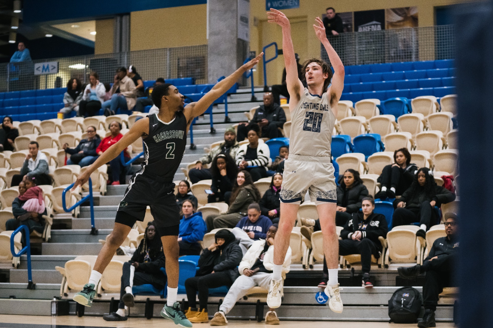 Harford's Theo Hess (right) hits a three-pointer over a Hagerstown defender.