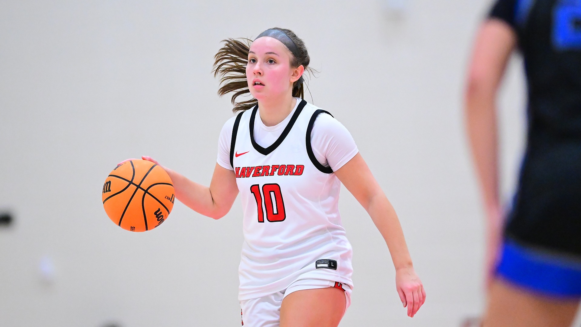 Bri Heafey dribbles down the court 