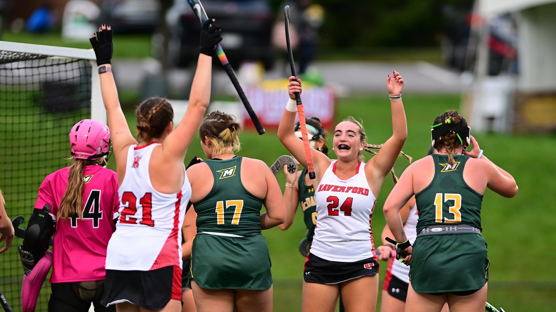 Morgan Reis and Kendall Fleet celebrate Reis' goal against McDaniel