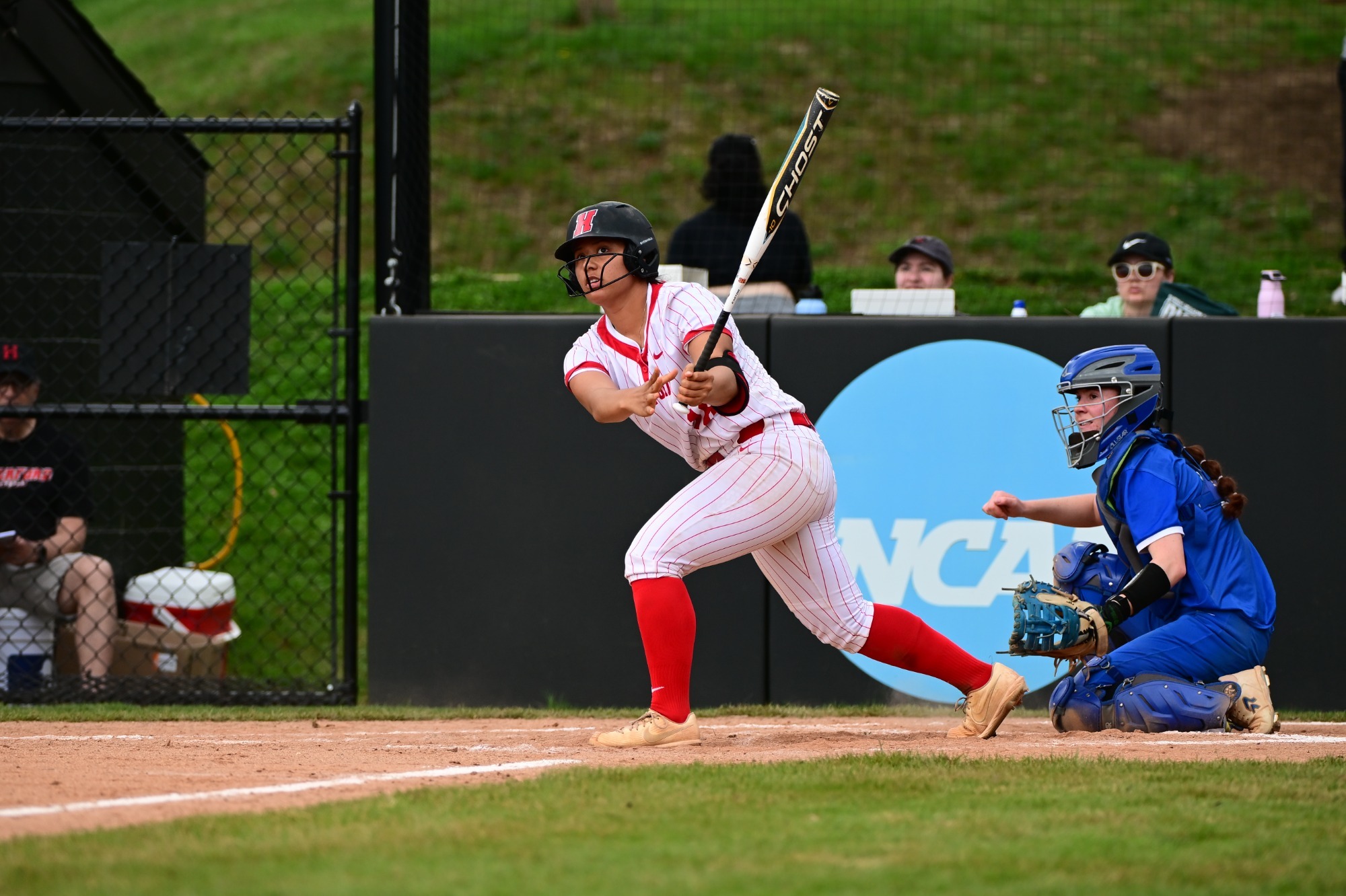 Kama Bode  in a red-pinstriped uniform and 