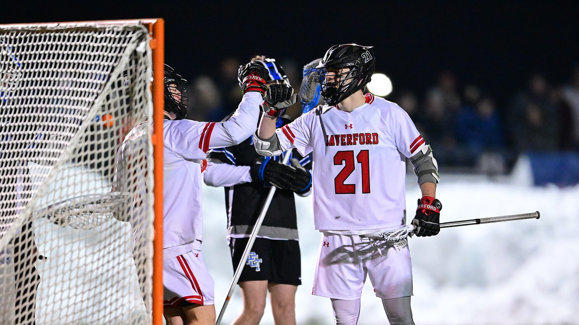 Haverford's Turner Elliott (21) celebrates a goal during a lacrosse game. Elliott finished the contest with a hat trick in the 12-11 victory.