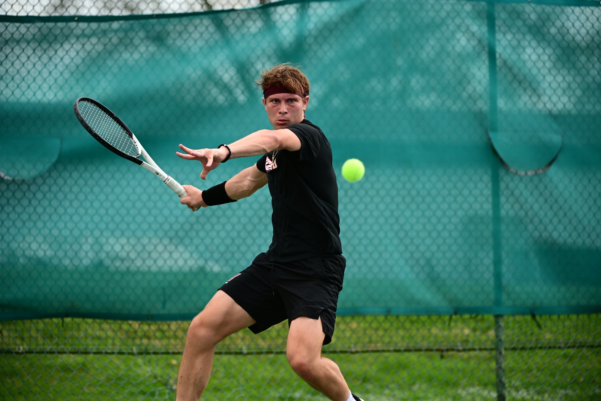 Haverford’s Marko Arboleda powers through a forehand during a match against Babson.