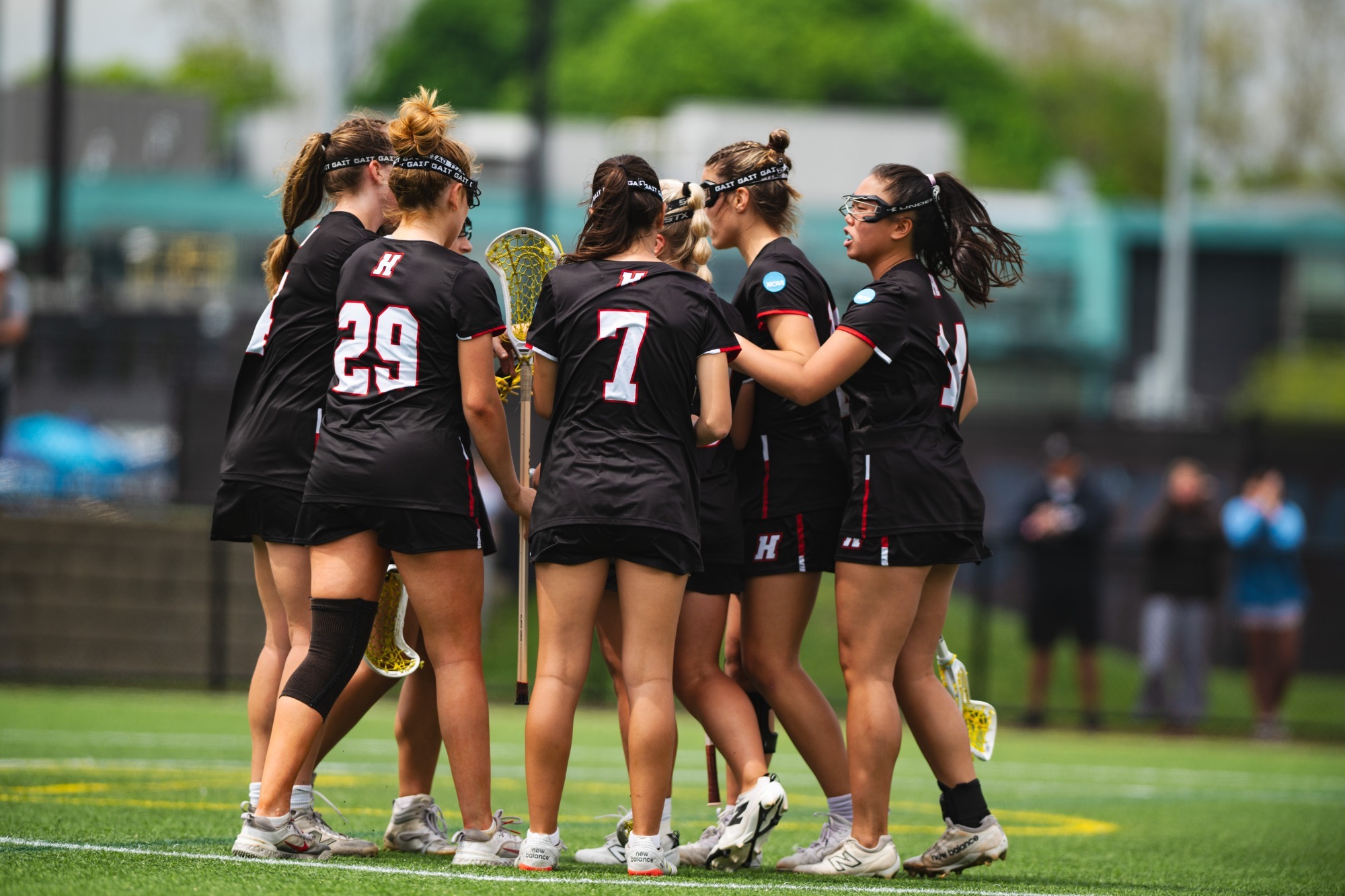 Haverford Women's Lacrosse team huddles up during its game against Tufts