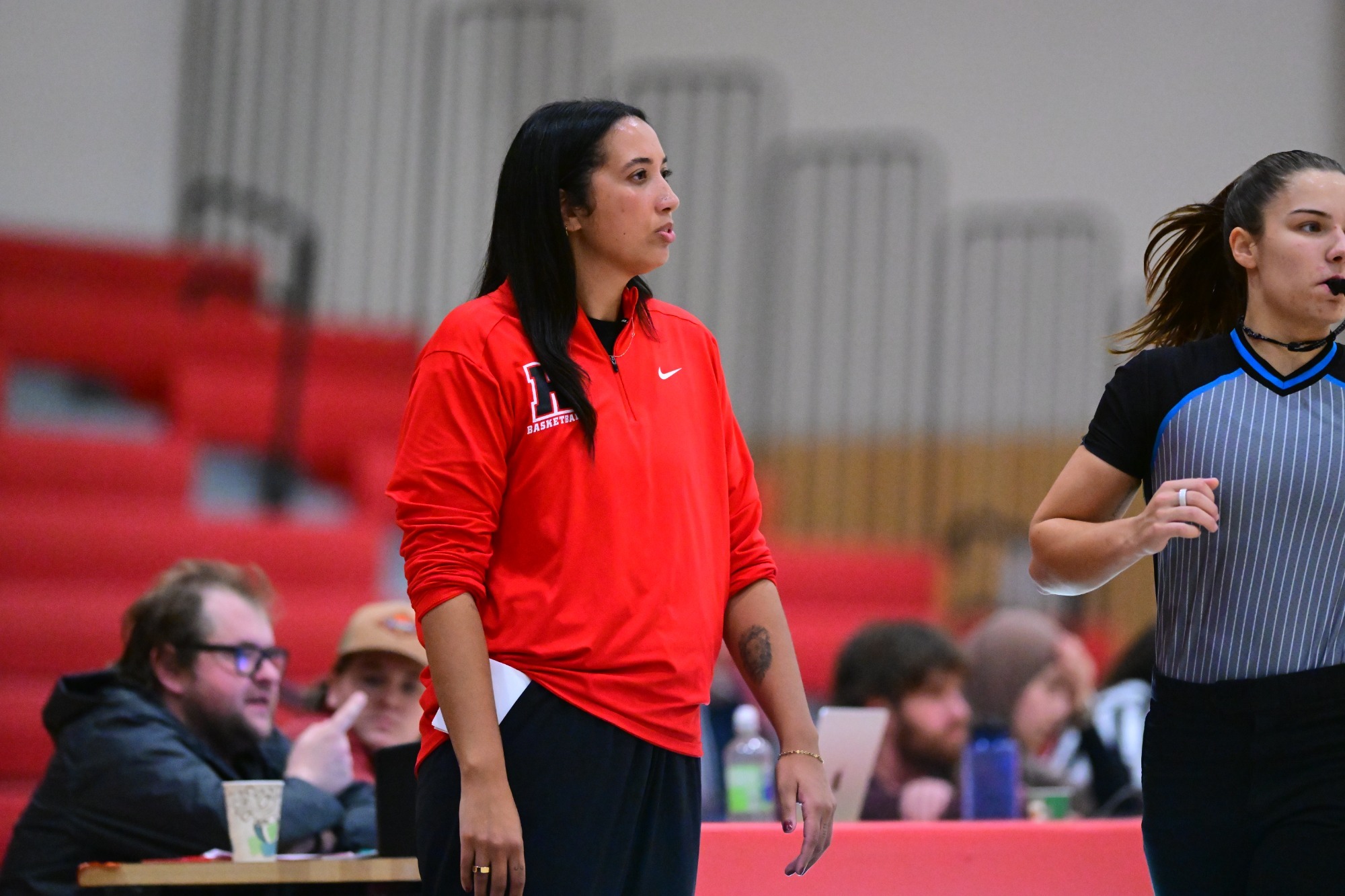Grace Elliott coaches during a game against Wilson College inside Gooding Arena