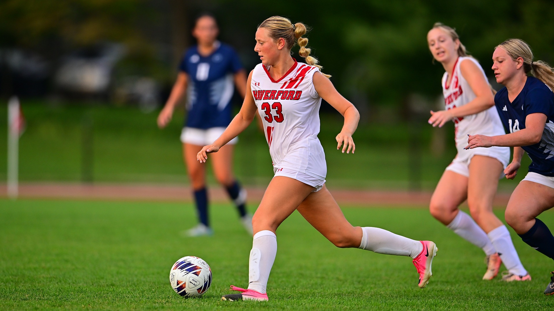 Clare Hawley dribbles through the defense in the Haverford Women's Soccer opener 