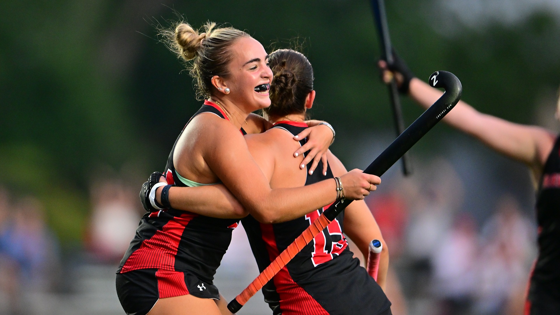 Morgan Reis hugs Louisa Coughlin