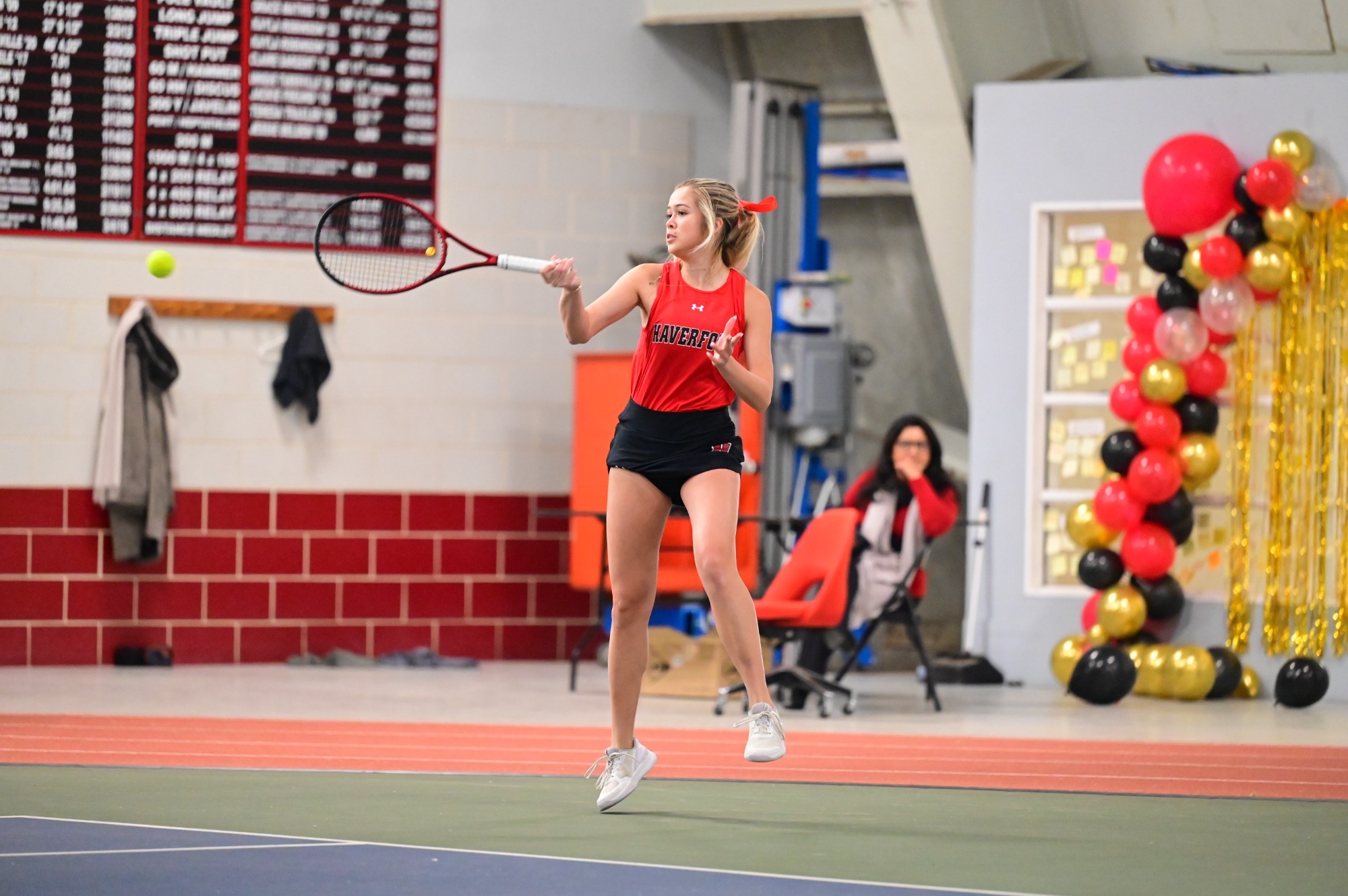 Jolie Zink serves indoors for the Fords