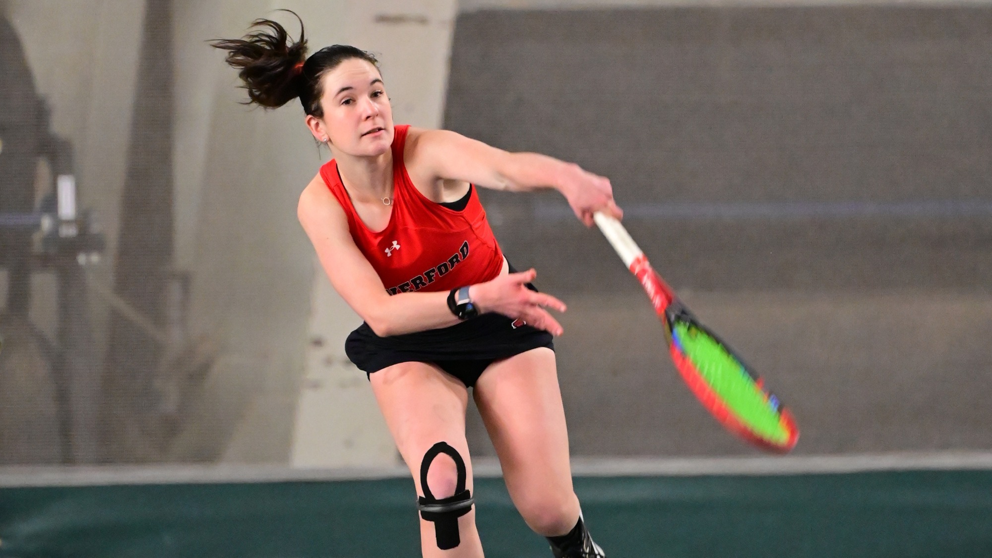 Addy Kreutel serves indoors for the Fords