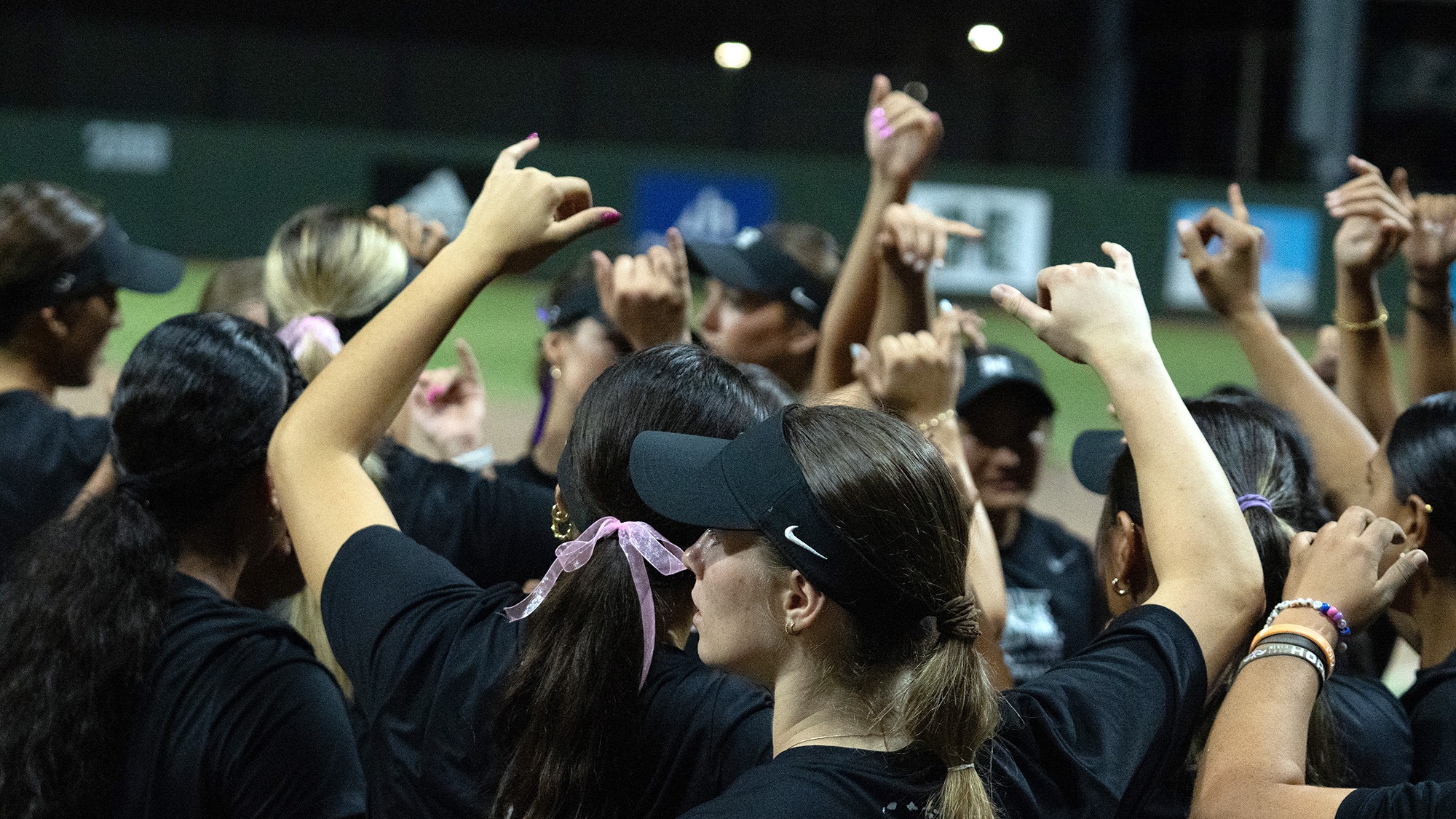 Softball huddle - vs. HPU