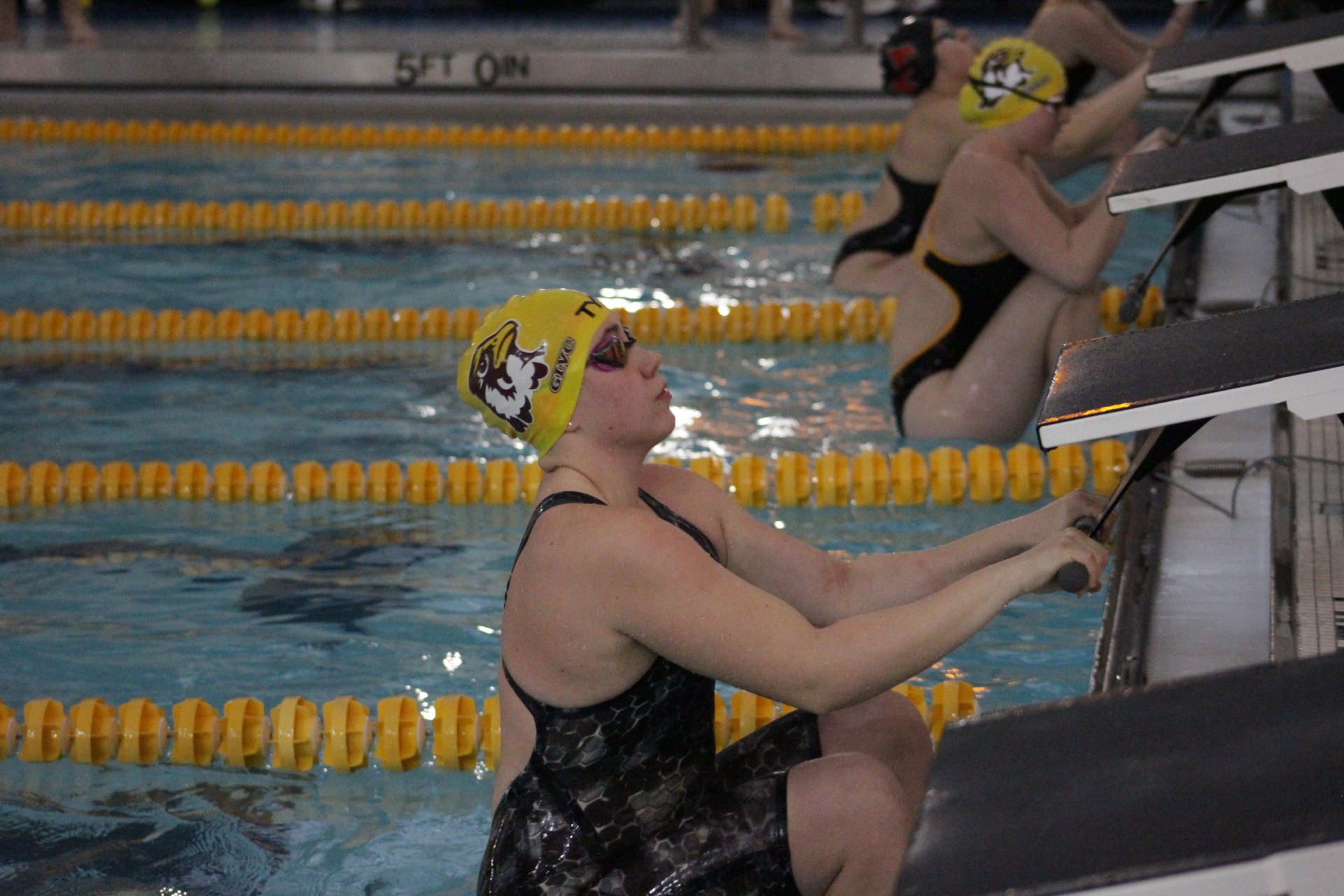 The Hawks get ready to swim backstroke.