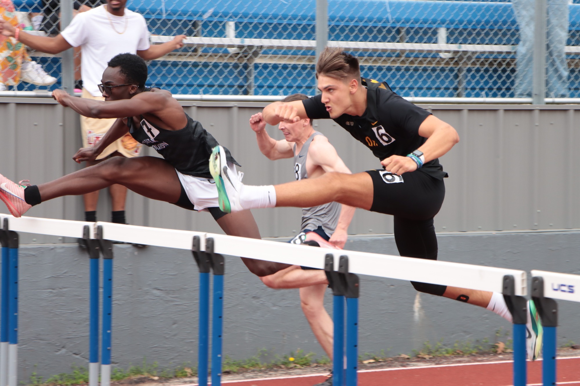 Landon Sprous jumps over the hurdles.