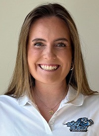 A headshot of Catie Holohan, who is wearing a white polo