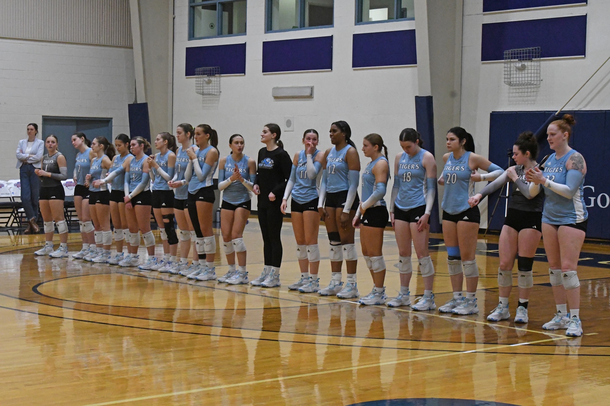 The HFU Volleyball Team lined up during introductions prior to the CACC Championship Match