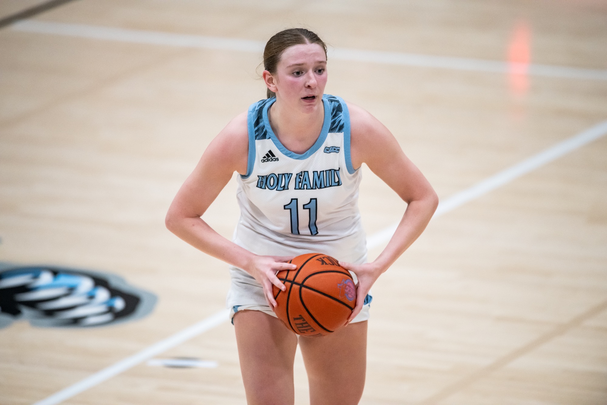 A closeup of Kara Meredith about to pass the ball