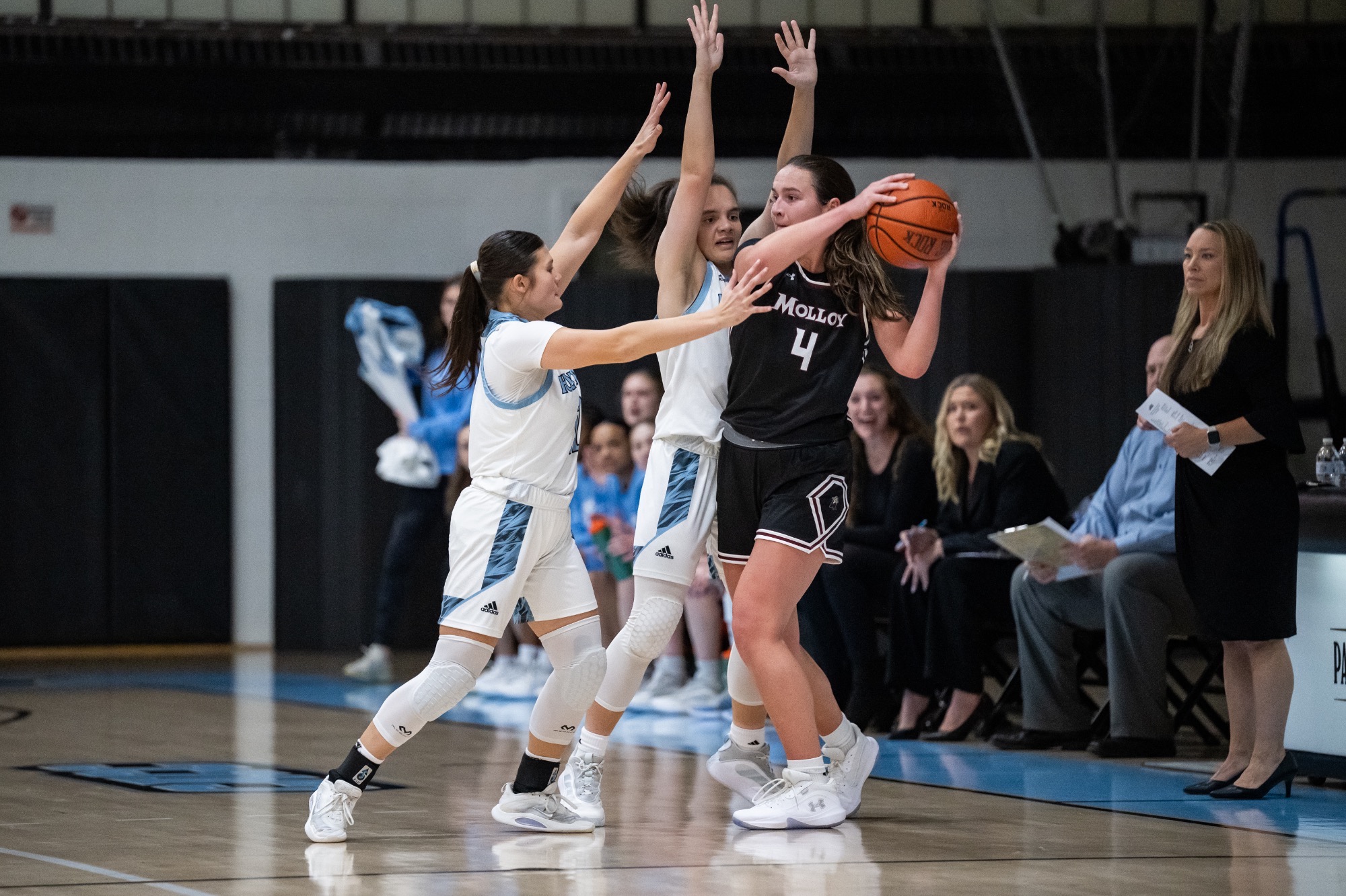 Kaleah Carter and Amy Ngo swarm an opponent on defense