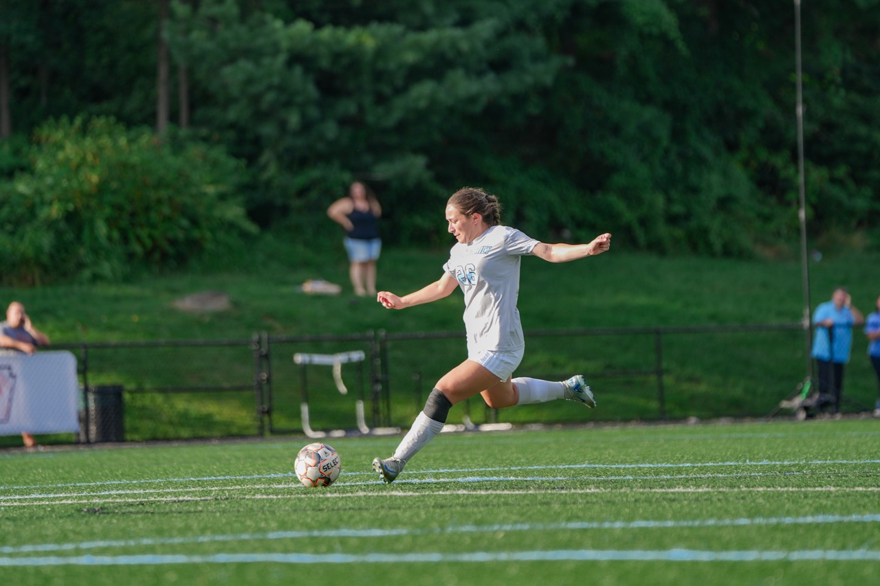 Samantha Pastino is about to kick the ball with her right foot