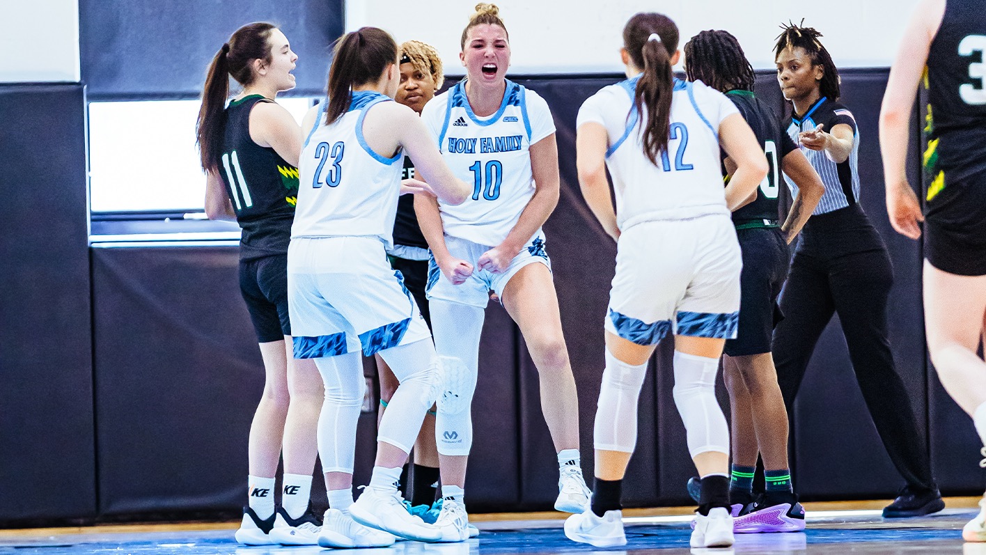 Taylor Hinkle celebrates an and-one with her teammates