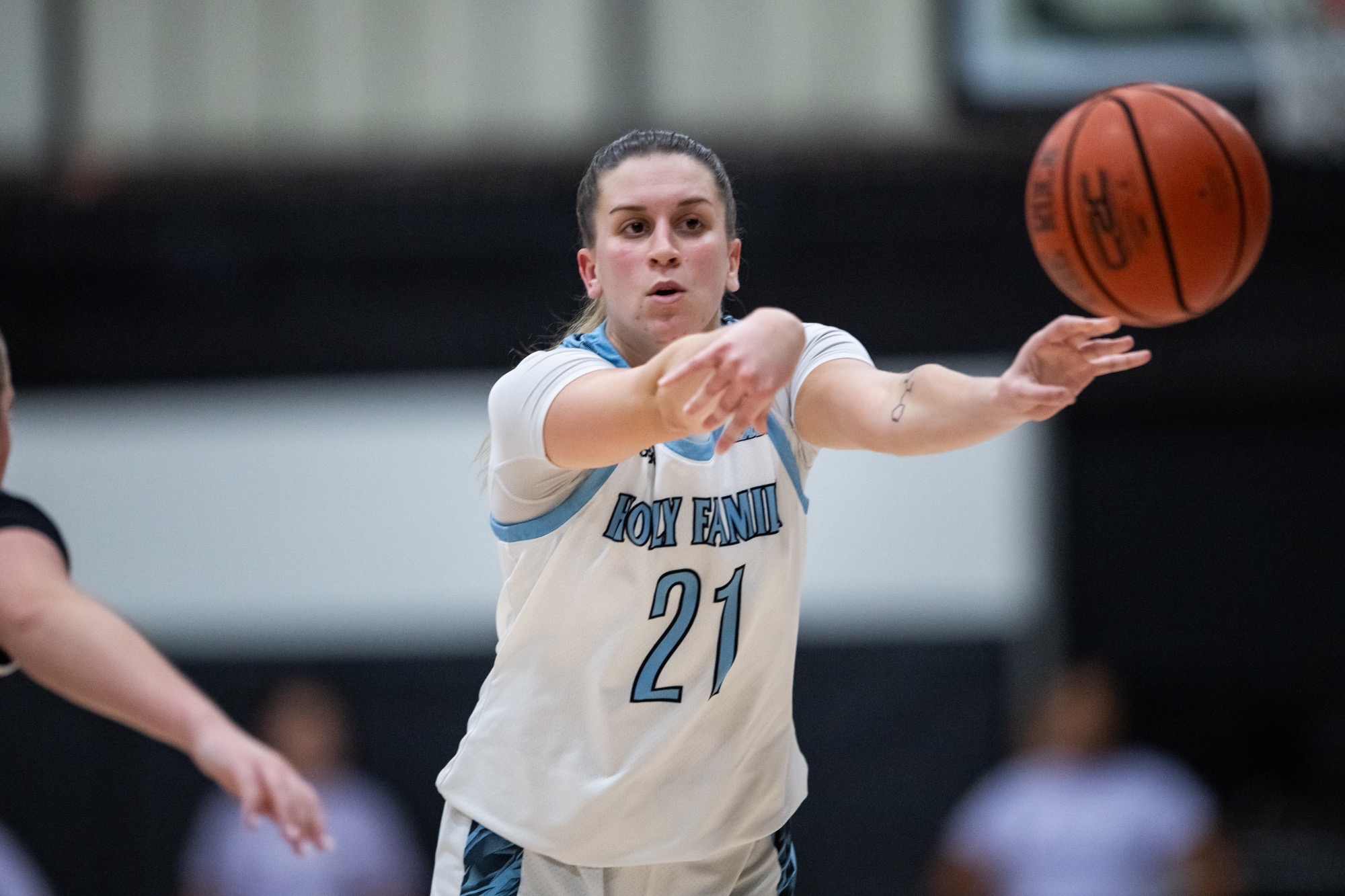 A closeup of Skyler Searfoss passing the ball