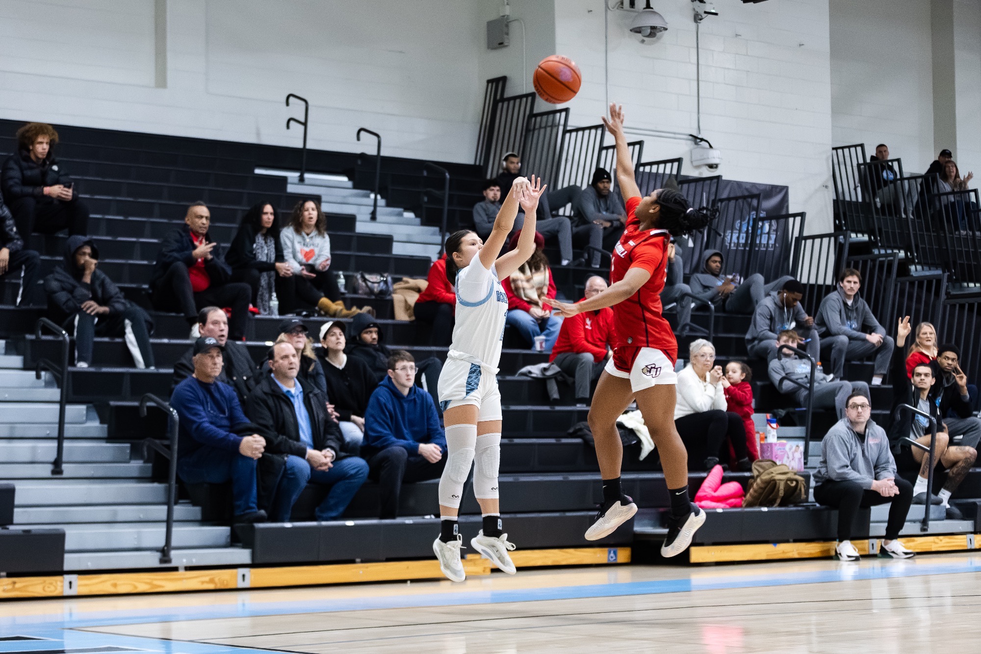Amy Ngo shooting. 3-pointer over an outstretched defender 