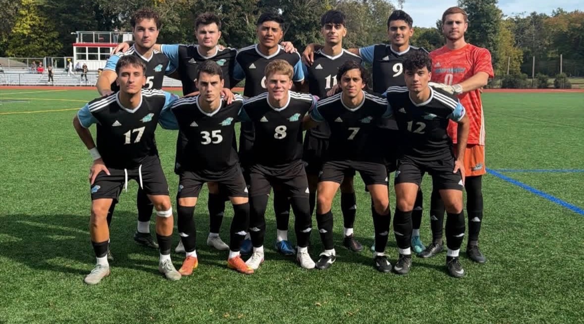The starting 11 of the HFU Men's Soccer teams takes a group picture prior to its match at Dominican