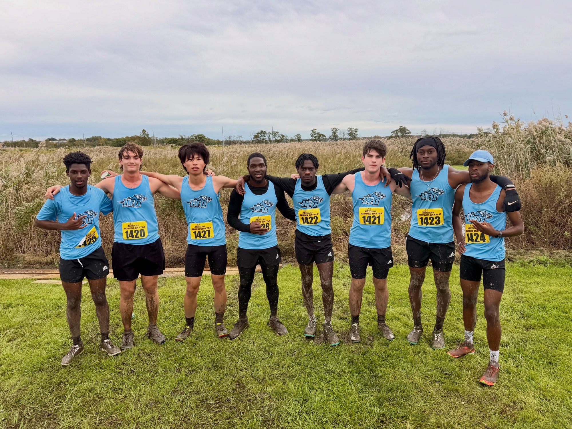 The 2026 HFU Men's Cross Country Team takes a group picture at Rowan's Border Battle