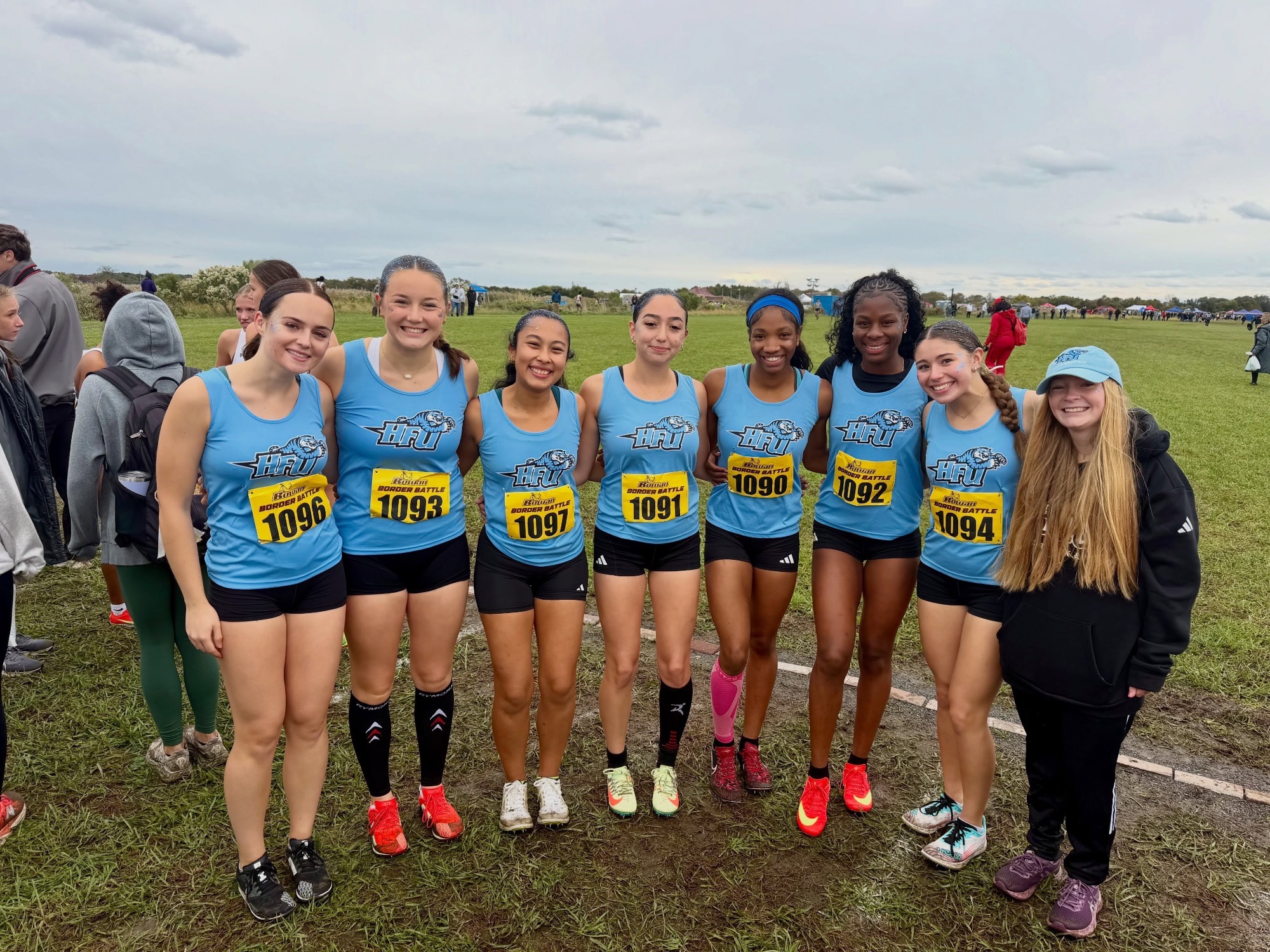 The 2026 HFU Women's Cross Country Team takes a group picture at Rowan's Border Battle