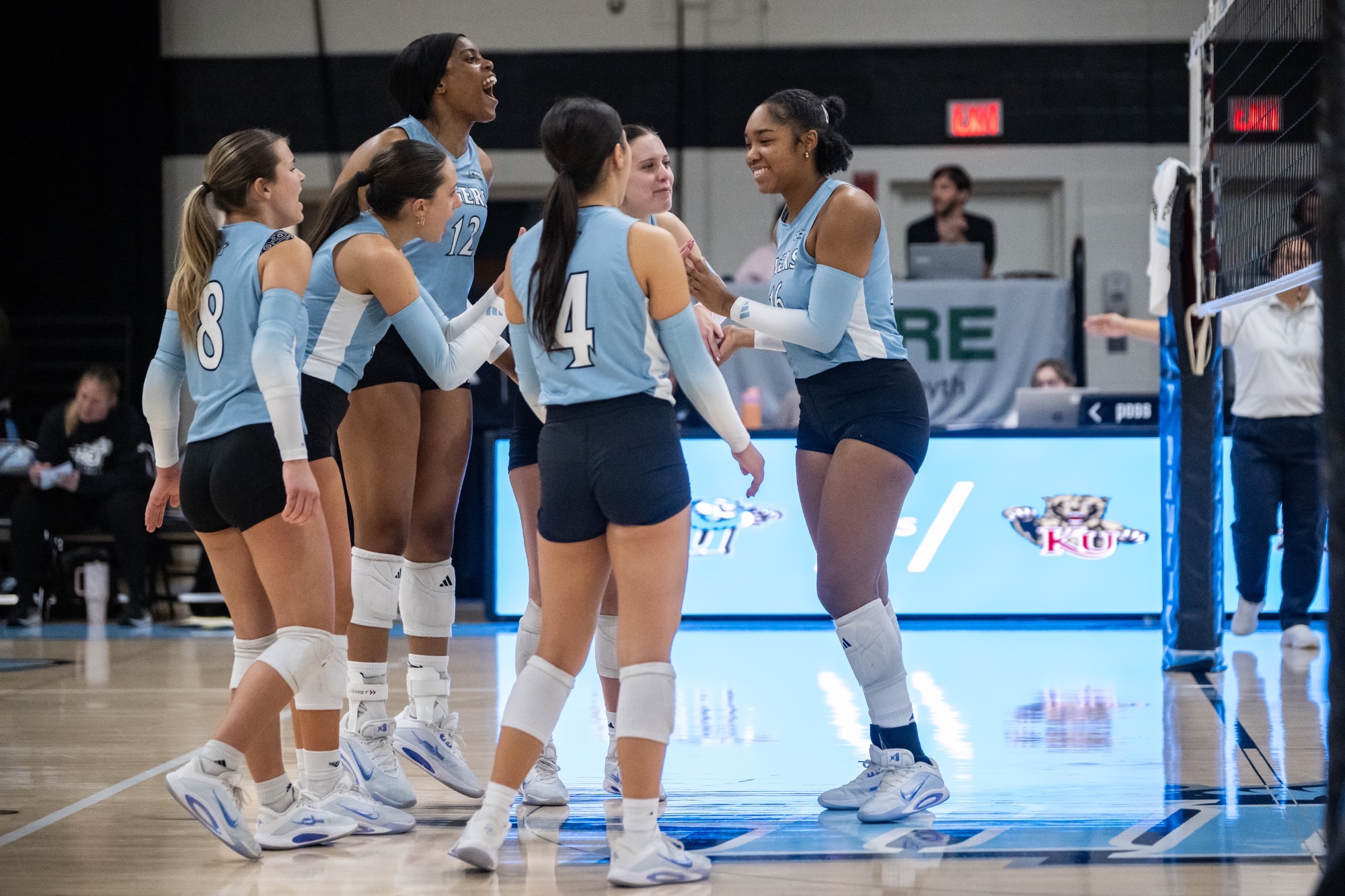 Allana Johnson celebrates with her teammates following a point