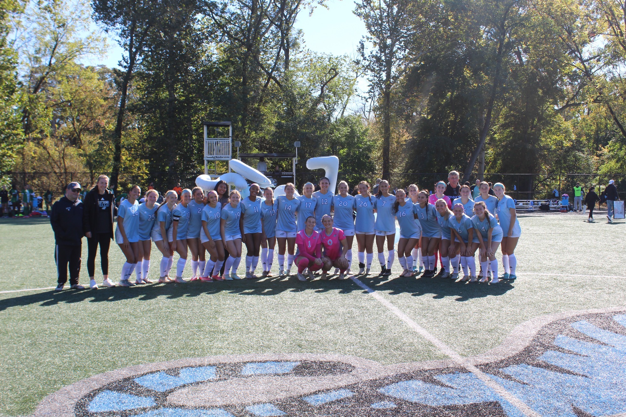 The 2026 HFU Women's Soccer Team takes a group picture on the field for Senior Day