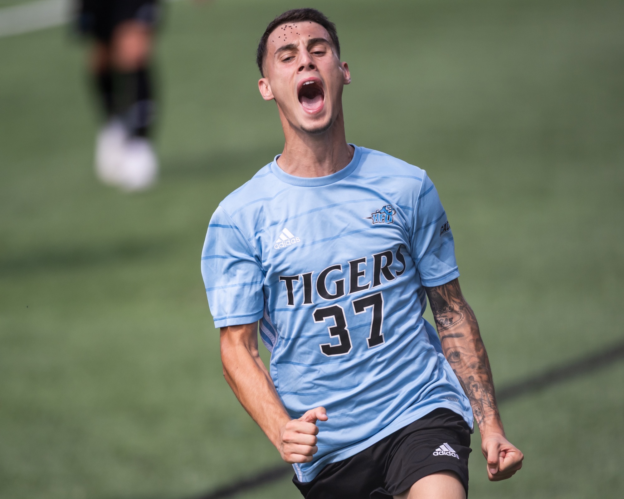 A closeup of Diego Palomera Herrera screaming 