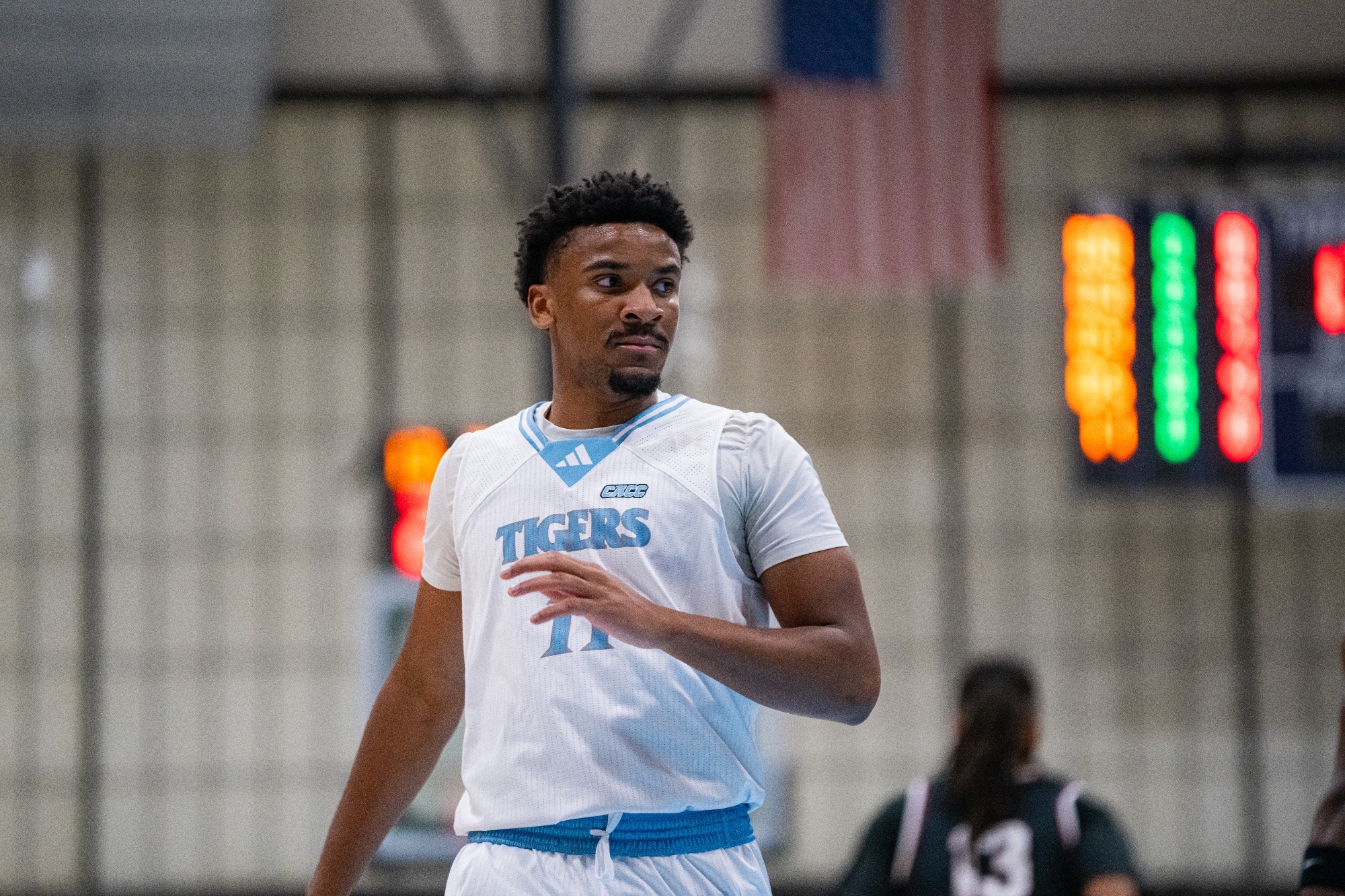 A closeup of Omarion Jett looking to his left