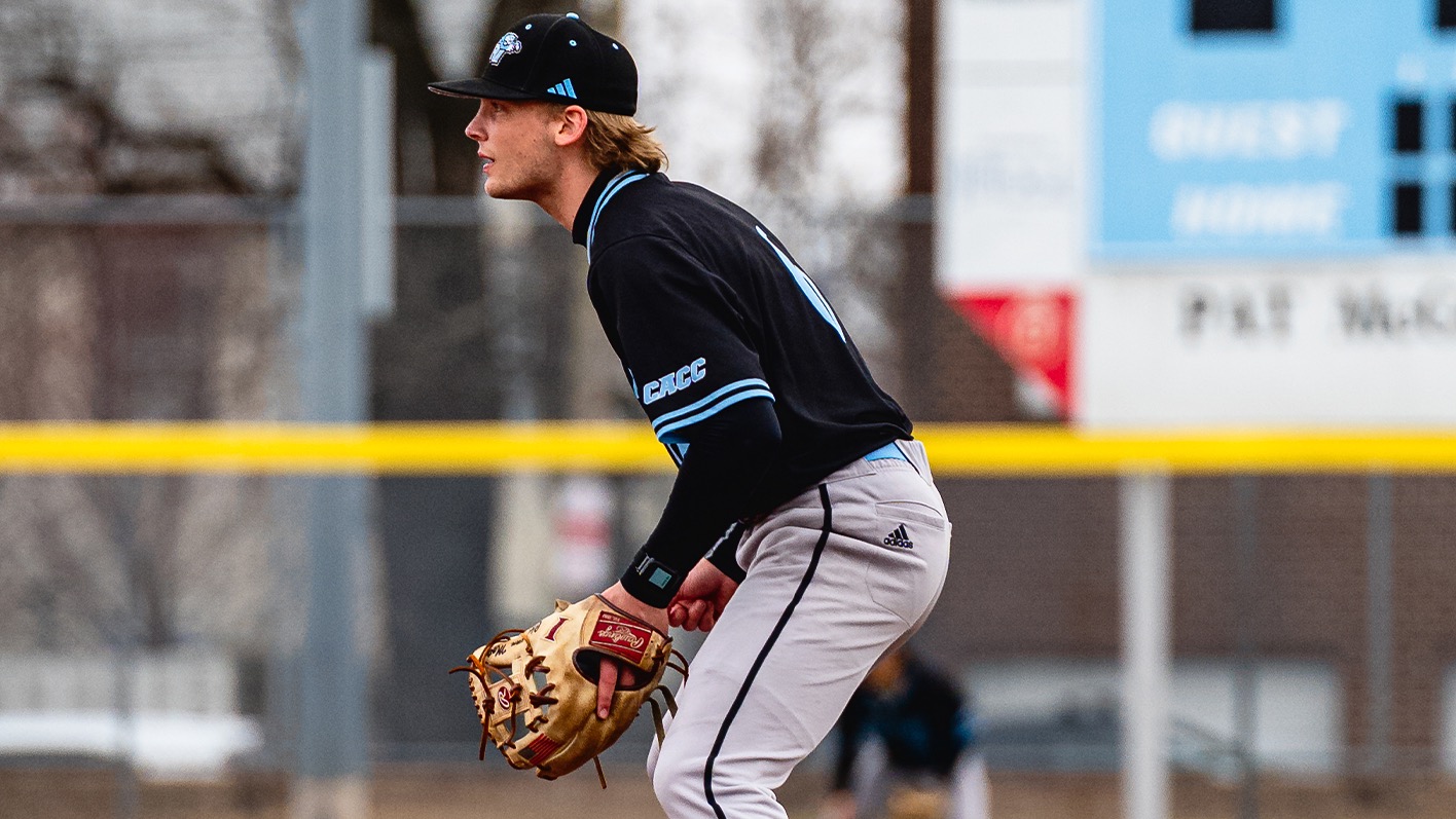A closeup of second baseman Christian Mote, from the side, as he gets into ready position as a pitch is thrown