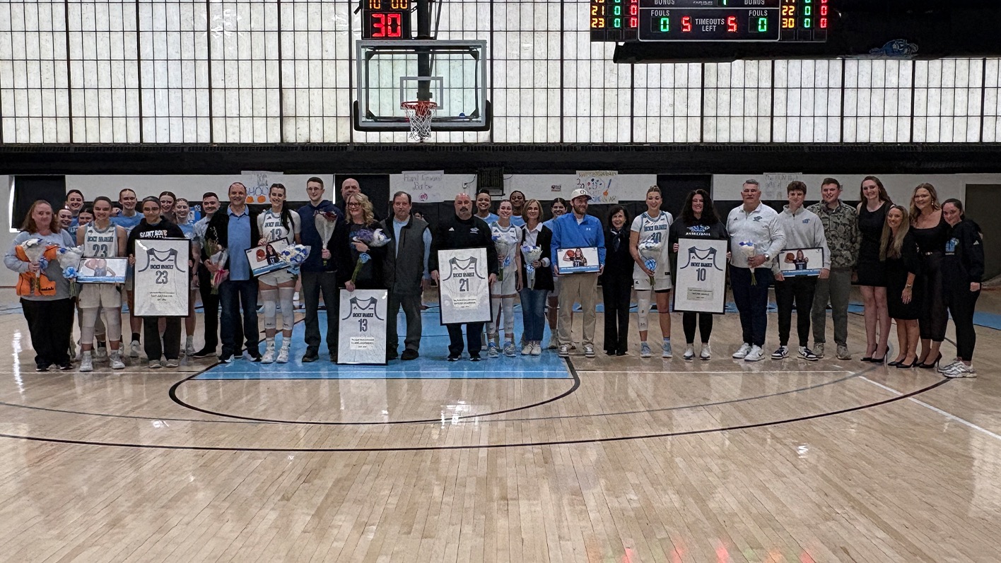 The HFU Women's Basketball Class of 2026 gathers for a group picture with family, friends, teammates and coaches