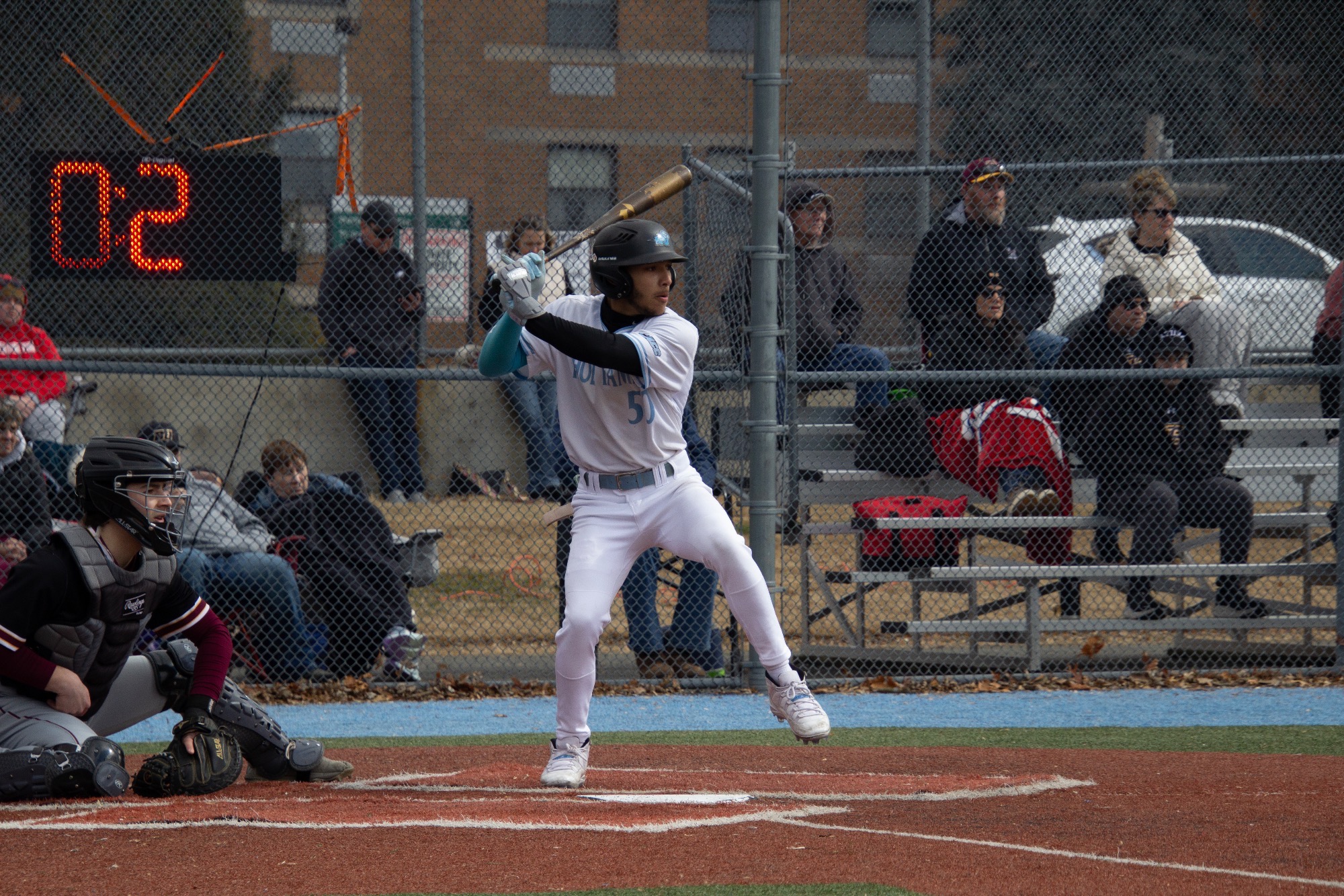 Jalen David prepping to swing from the right-handed batter's box, his left foot in the air