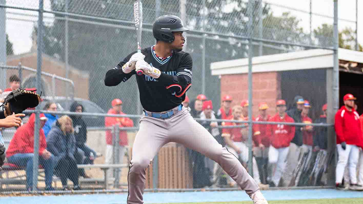 Right-handed Andres Rivera prepares to swing as a pitch is being thrown 
