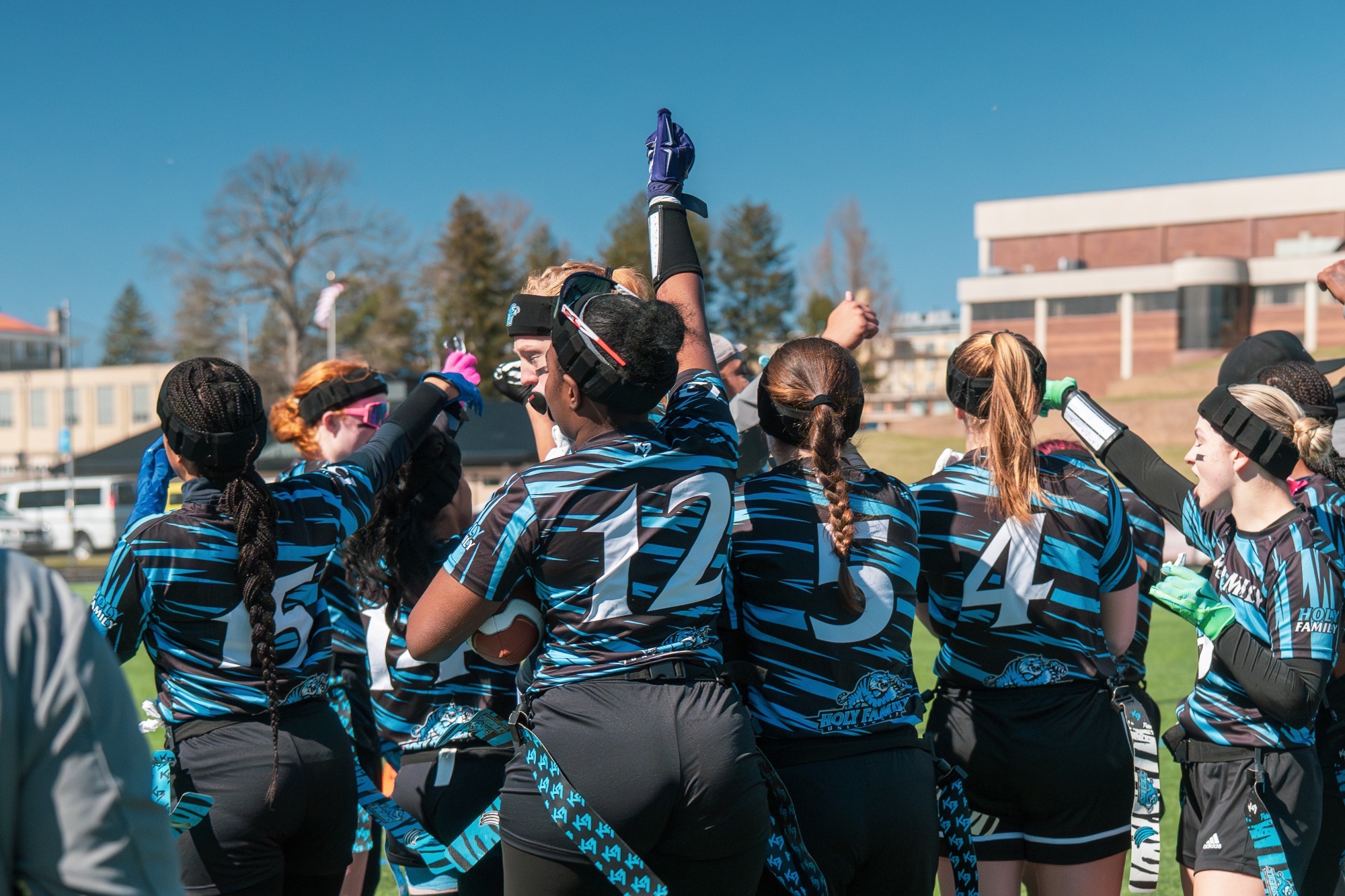 The 2026 HFU Flag Football Team breaking a huddle