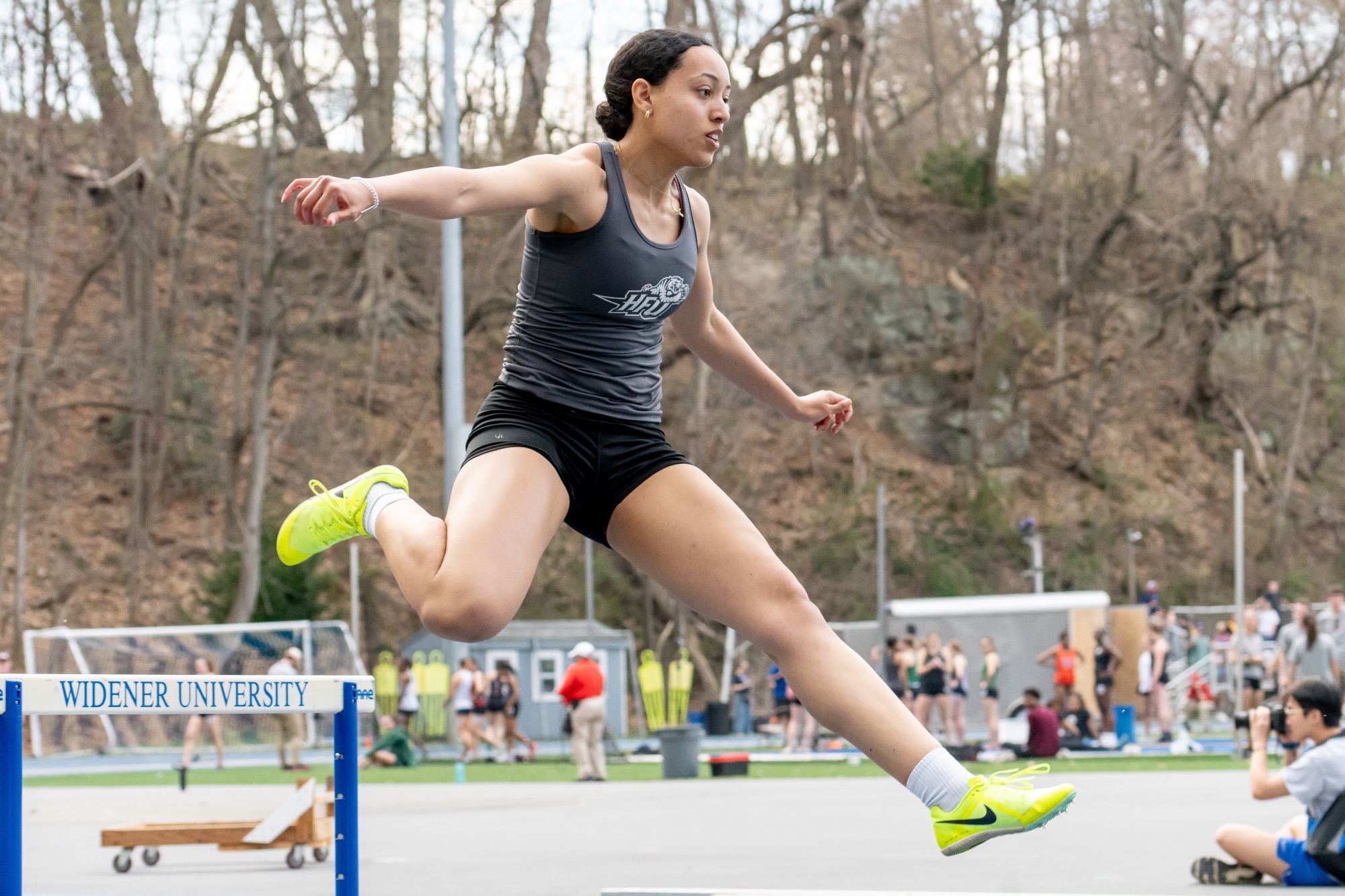Brianna Coates jumps over a hurdle