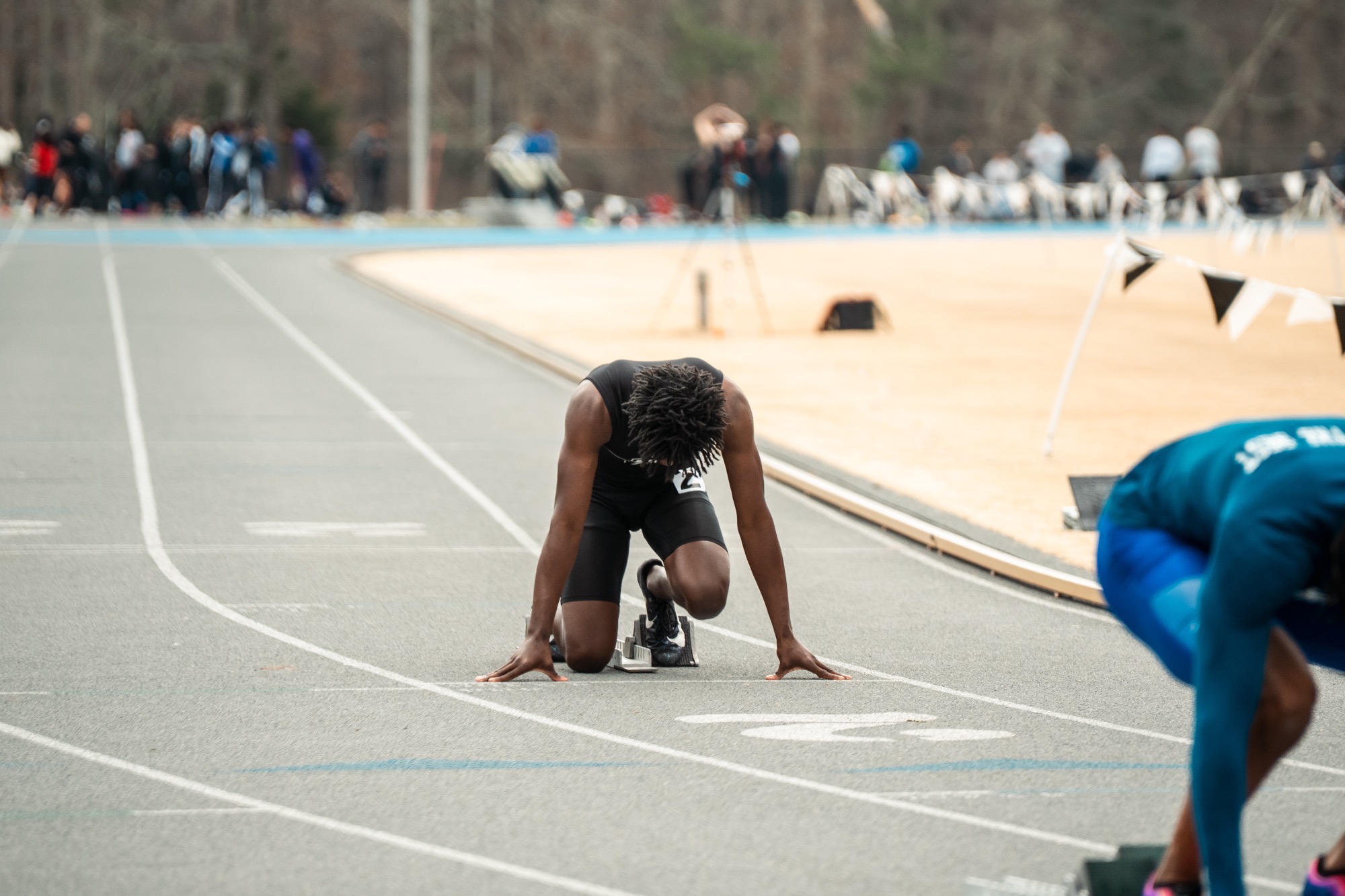 Al-Amin Page with his head down at the starting block