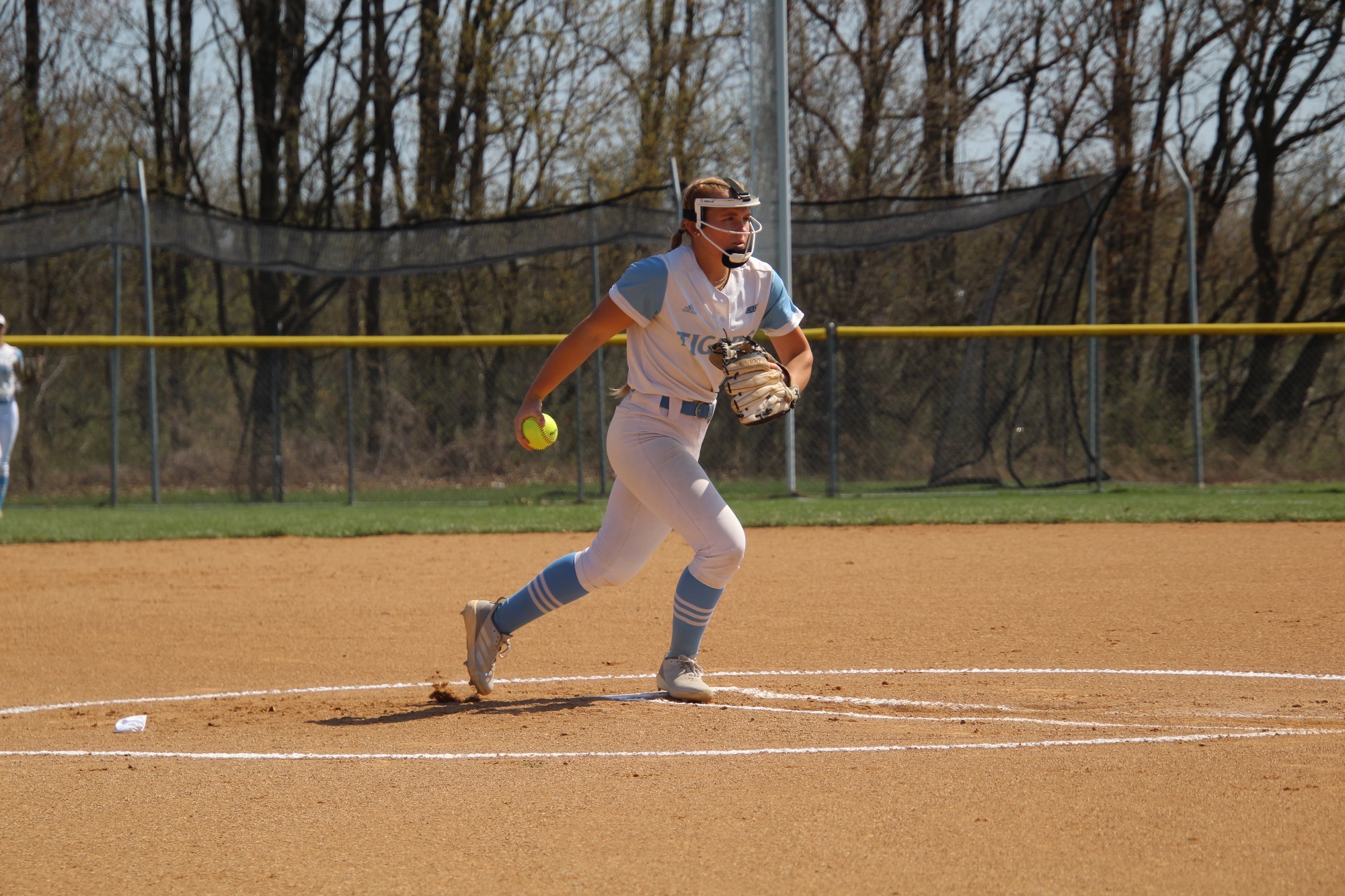 Right-handed Kinsley Hall begins her pitching motion 